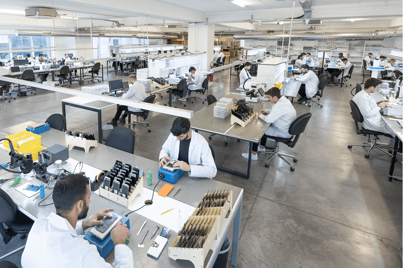 Wide view of the Remalab laboratory floor with technicians at work